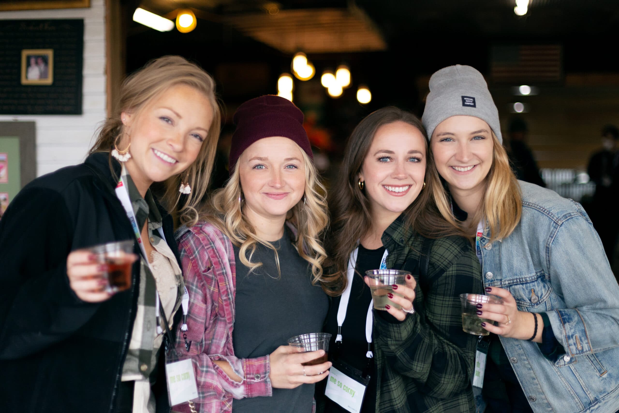 Four women drinking wine from Pink Barrel Cellars enjoying Fall activities in Grand Rapids.