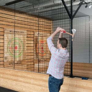 Person preparing to throw an axe at a target at FlannelJax's