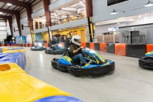 People race around a go-kart track at Grand Rapids Grand Prix