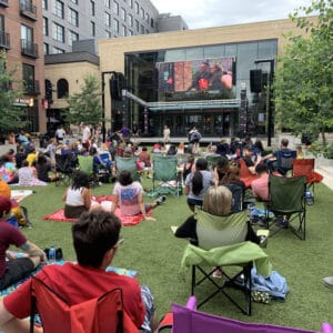 Sunset cinema event grand rapids Michigan people watching movies outside at Studio Park