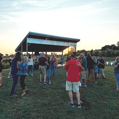 Fall dancing at an apple orchard on fruit ridge in Grand Rapids